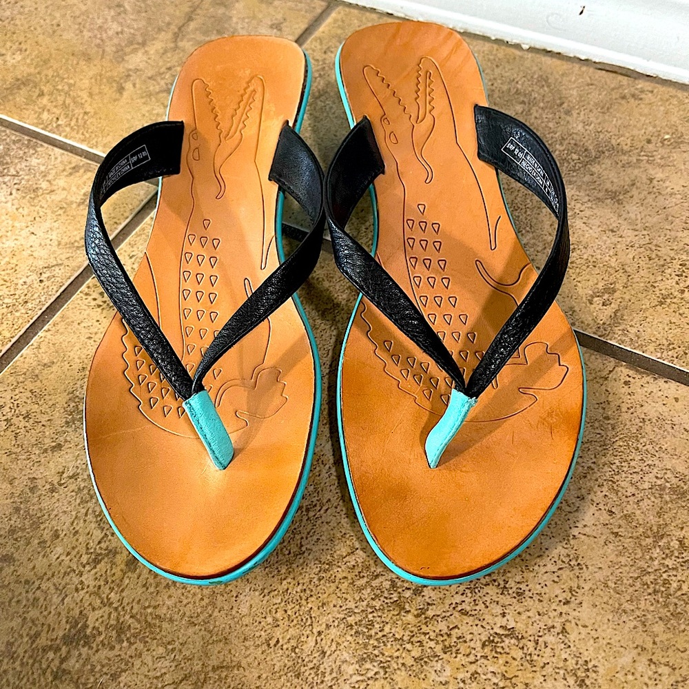 Lacoste Black leather sandals with turquoise bottom with kitten heel.  Size 8